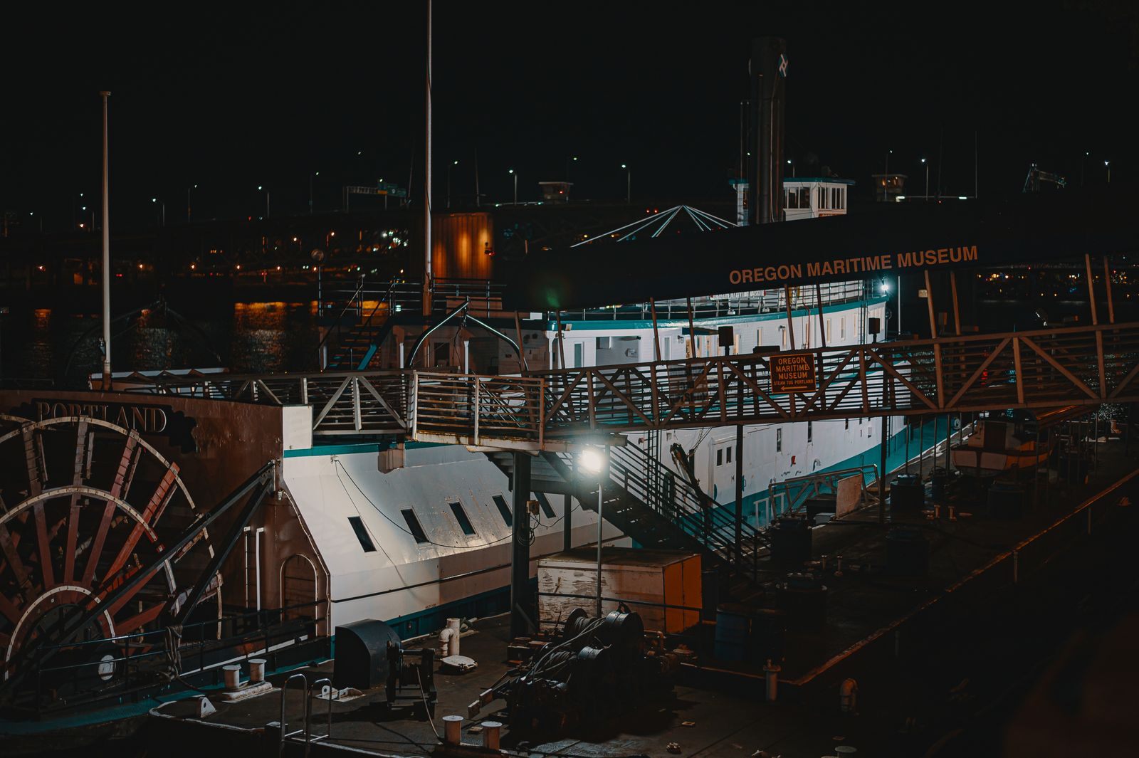 Sternwheel paddleboat docked at night at the Oregon Maritime Museum in Portland, where sternwheeler cruises on the Columbia River begin